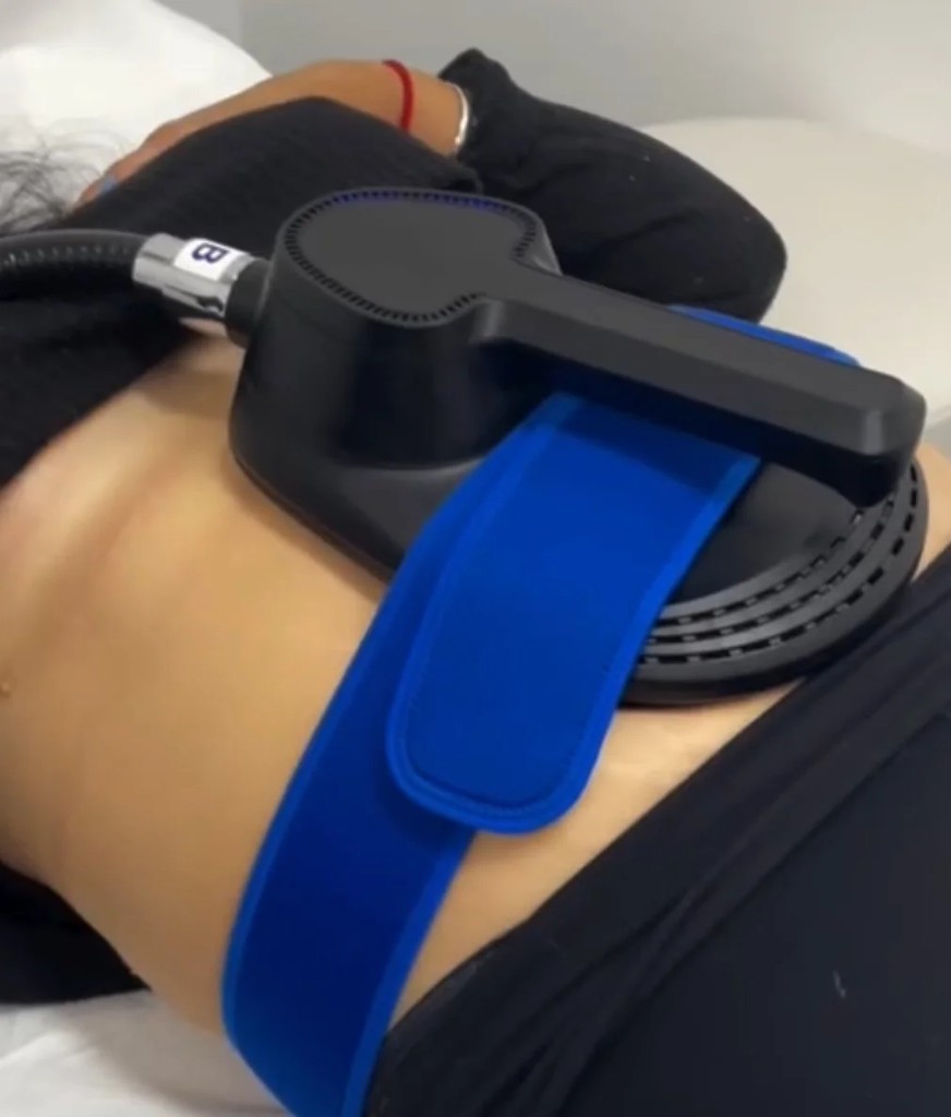 Muscle Builder applicator strapped across the abdomen